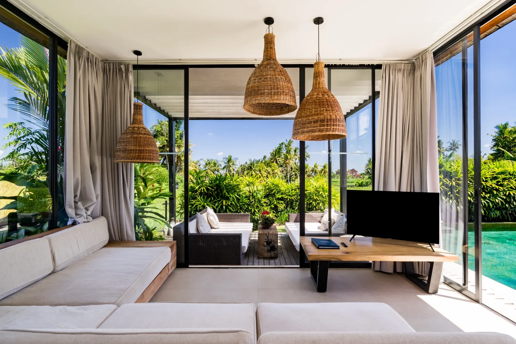 The open living pavilion of the villa, set up for a family together