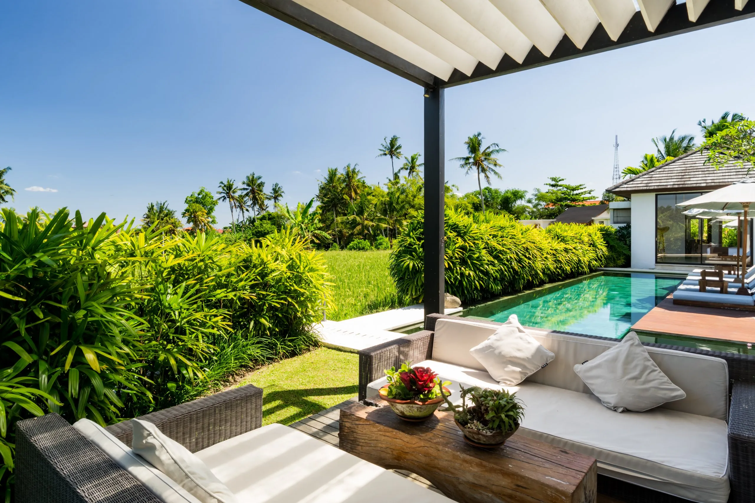 The pool deck back at the villa in the afternoon